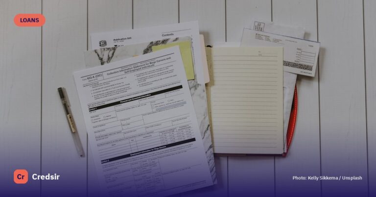 Stack of papers flat lay photography — cover photo for Credsir’s Personal Loan Eligibility guide