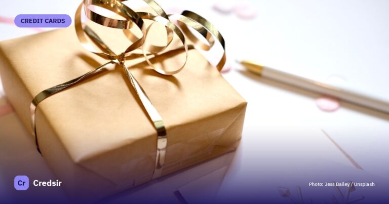 A gift wrapped in brown paper with a gold ribbon — cover photo for Credsir’s Is Real Estate a Good Investment in India guide