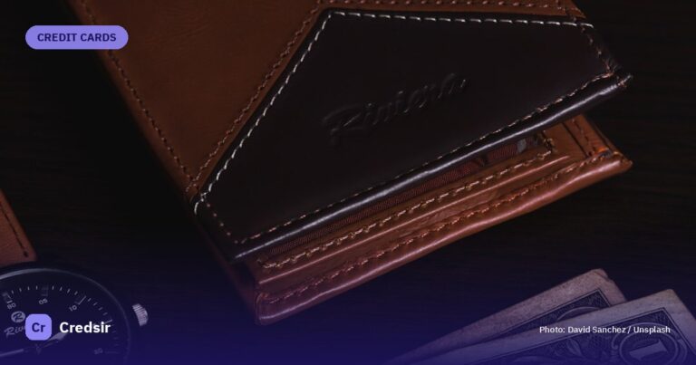 Brown leather bifold wallet on black and white textile — cover photo for Credsir’s YES Bank Marquee Credit Card guide