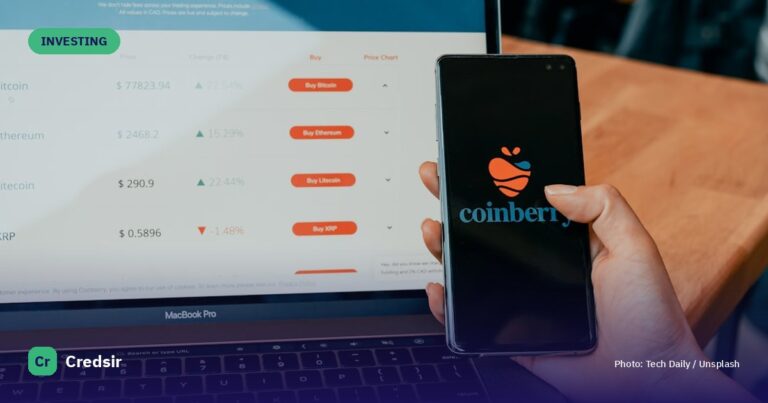 Black iphone 7 plus on macbook pro — cover photo for Credsir’s What Is the Stock Market guide