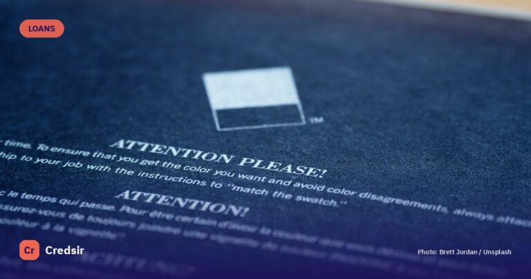 White card on blue textile — cover photo for Credsir’s Lowest Interest Rate Personal Loans guide
