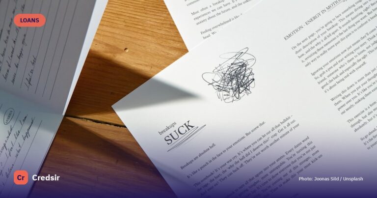A close up of some papers on a table — cover photo for Credsir’s How to Apply for a Personal Loan guide