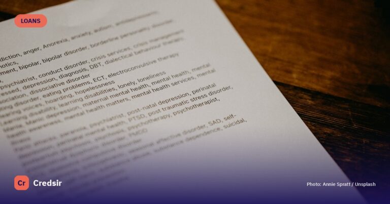 White printer paper on brown wooden table — cover photo for Credsir’s How to Get guide