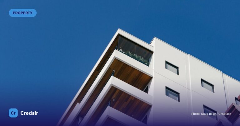White concrete building with balconies during day — cover photo for Credsir’s RERA Maharashtra guide