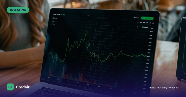 Laptop showing stock chart on desk — cover photo for Credsir’s Silver Etfs guide