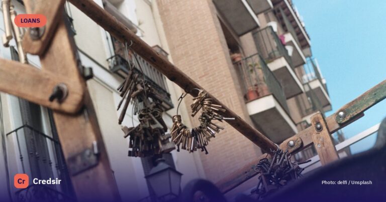 Black metal fence near brown concrete building during daytime — cover photo for Credsir’s Used Car Loan Interest Rates guide
