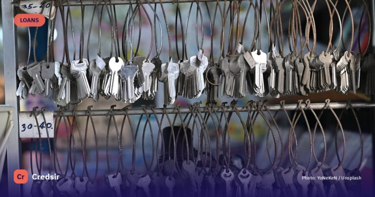 A bunch of keys are hanging on a rack — cover photo for Credsir’s Lowest Car Loan Interest Rates guide