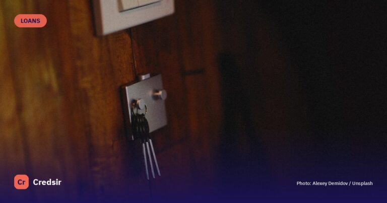 A wall mounted light switch on a wooden wall — cover photo for Credsir’s Mortgage Loan Calculator guide