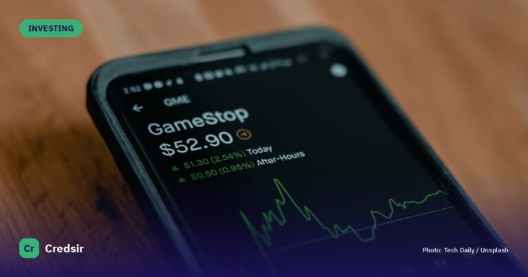 Black android smartphone on brown wooden table — cover photo for Credsir’s Intraday Trading guide