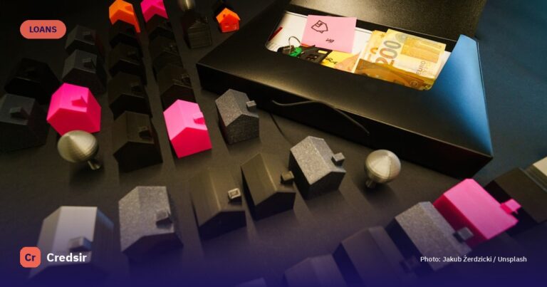 Miniature houses arranged with cash in an open box — cover photo for Credsir’s Home Loan Interest Rates All Banks guide