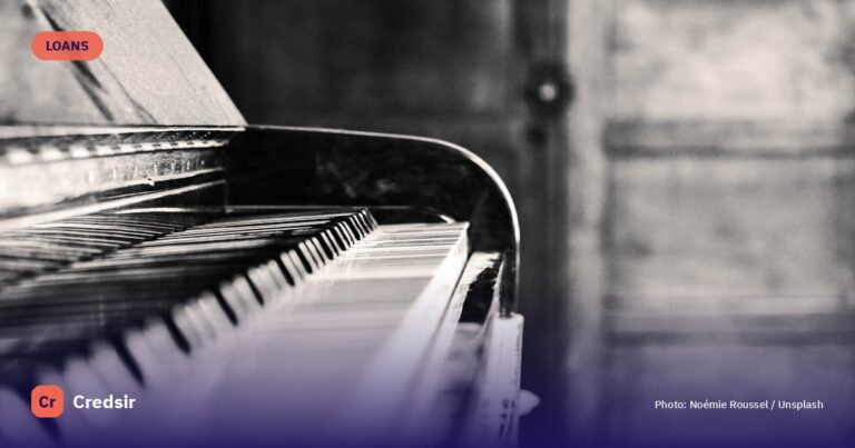 Black and white upright piano — cover photo for Credsir’s Business Loan Interest Rates guide