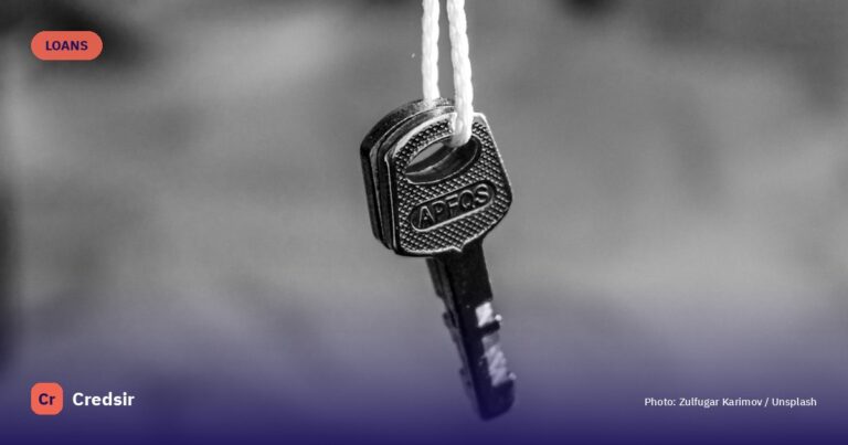 A single key hangs from a white string — cover photo for Credsir’s Indian Bank Gold Loan Interest Rate guide