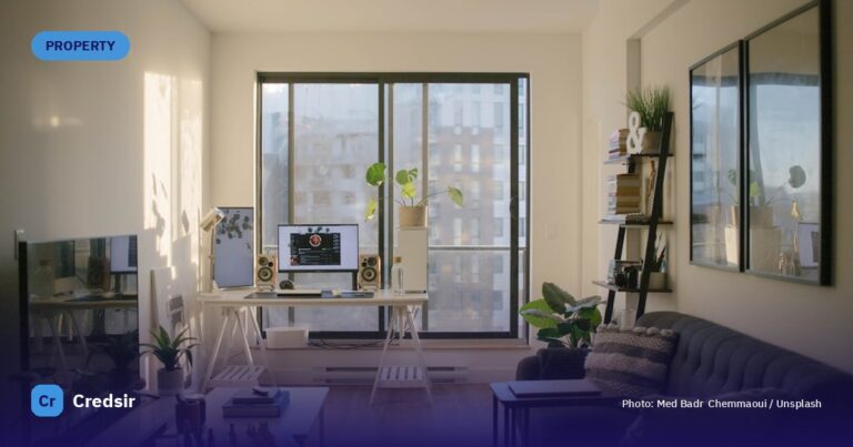 A sunlit home office with a desk, computer, and sofa in a living room — cover photo for Credsir’s Best REITs to Invest in Ind