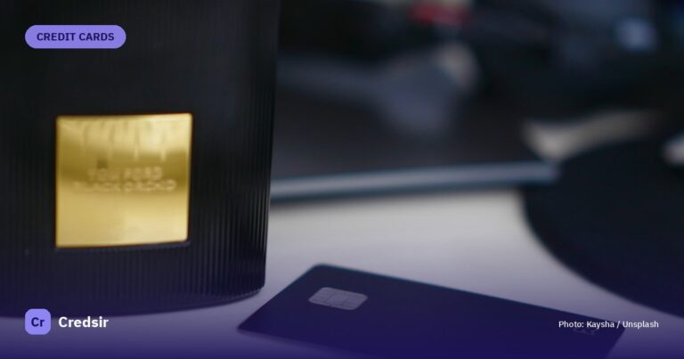 Selective focus photography of black card on white table — cover photo for Credsir’s YES Bank YES First Exclusive Credit Card